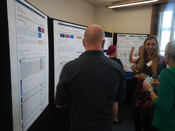 Customers gather around the New Feature Showcase