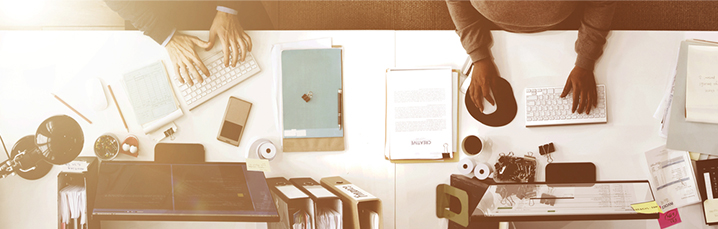 Aerial view of people working at a desk