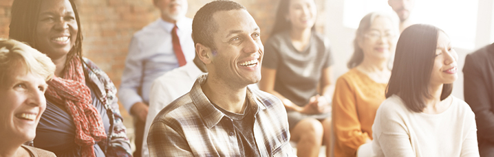 Auditorium of laughing people