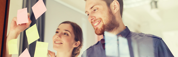 Team writing post it notes