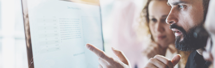 Team looking at computer