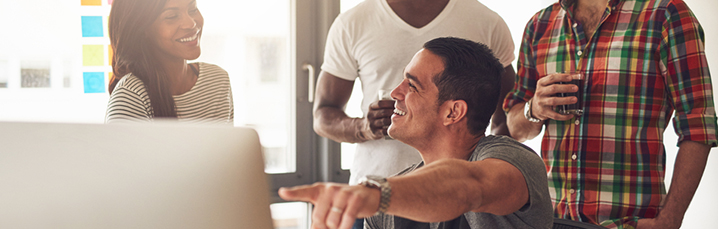 Team looking at laptop