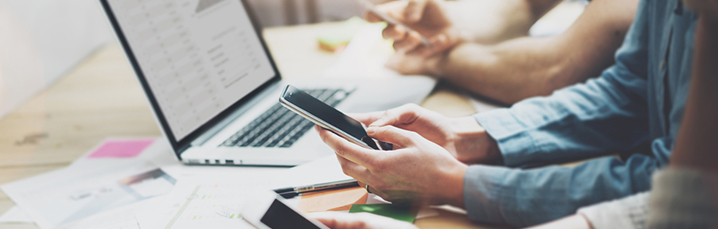 Person working on multiple devices
