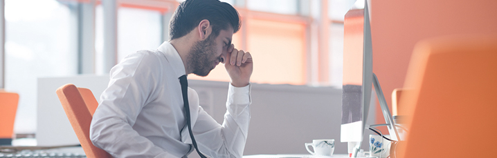 Man frustrated at laptop