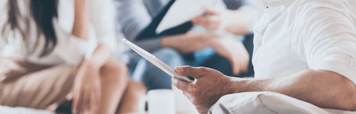 Office meeting with ipads