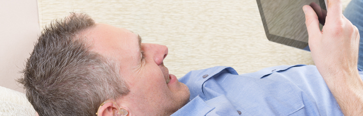 Web Accessibility Man Reading On Tablet