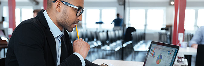 man sitting at computer